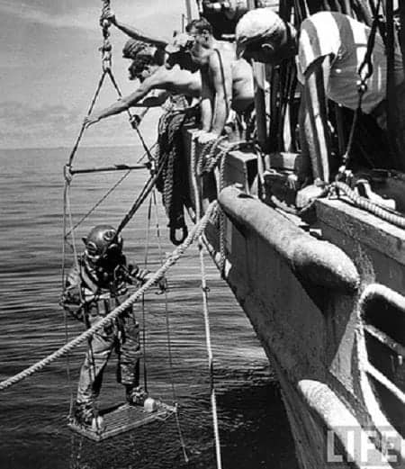 A diver searching for silver coins in Caballo Bay