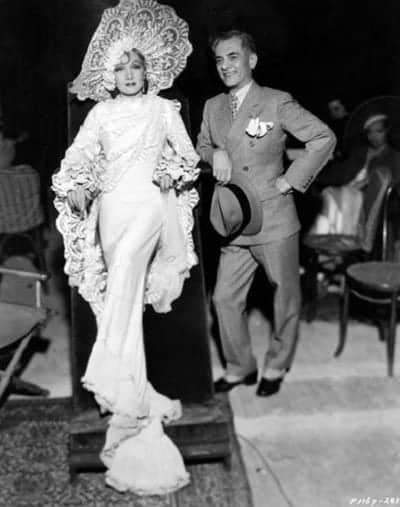 Manuel L. Quezon poses with Marlene Dietrich on the set of The Devil Is a Woman