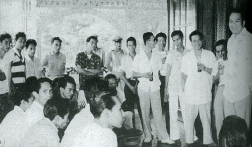 President Magsaysay seen on far right having a consultative session with jeepney drivers