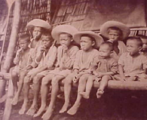 Filipino children smoking cigars