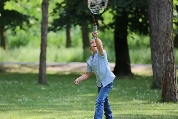child playing badminton